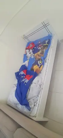 White single bed with mattress