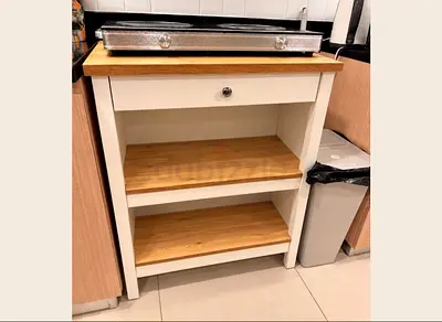 White wooden kitchen trolley with drawer and open shelves