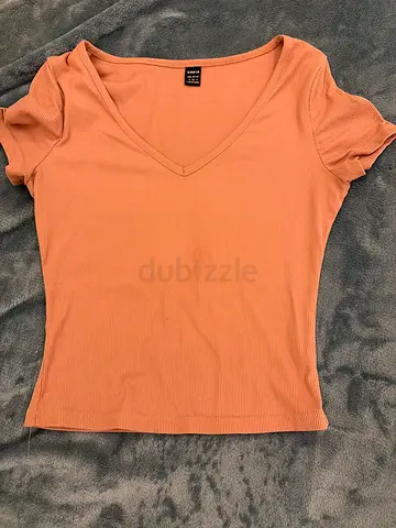 Light terracotta ribbed V-neck women's t-shirt