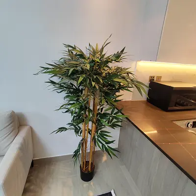 Tall artificial bamboo plant in black pot - excellent condition