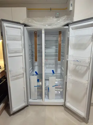 Brand new side-by-side refrigerator - unused, still with protective film