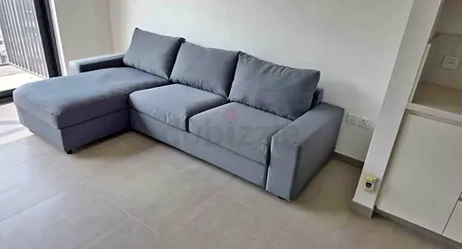 Light grey L-shaped 3-seater sofa bed with chaise (good condition)