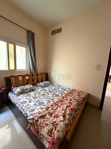 Wooden double bed frame with mattress — good condition