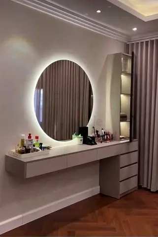 Custom made Wall-mounted vanity desk with illuminated round mirror and shelving