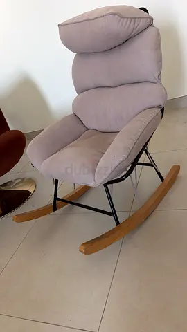 Comfortable padded rocking lounge chair with wooden runners