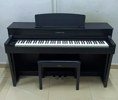 The Yamaha Clavinova CLP-645B is a high-quality 88-key digital piano in a matte black finish,