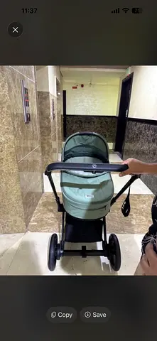 Light green pram stroller in good condition
