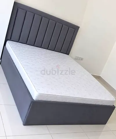 Grey upholstered Queen -size bed frame with mattress