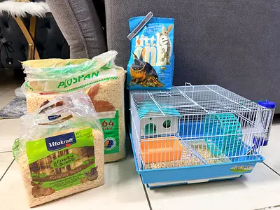 Hamster cage with bedding, food and all accessories