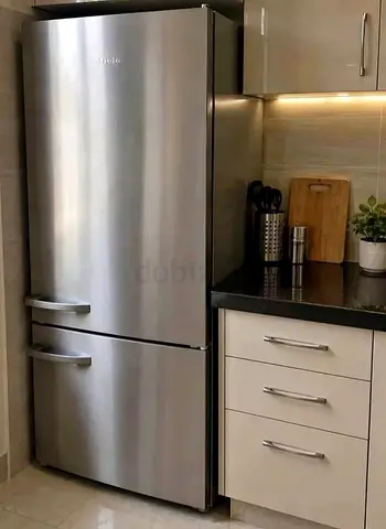 Miele bottom fridge and freezer new model slightly used new model