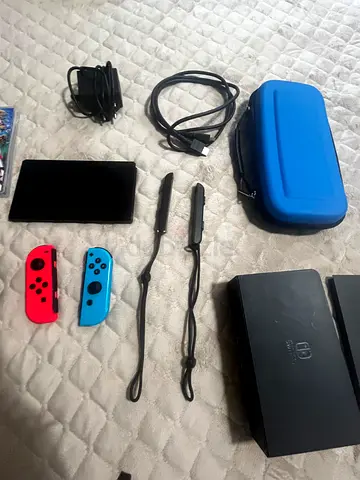 Nintendo Switch console with dock, Joy-Con (neon), case and charger