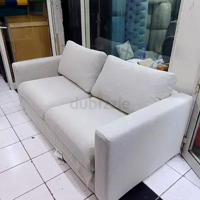 2-seater fabric sofa bed in good condition