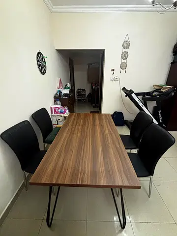 Wood-effect dining table with 4 black chairs - good condition