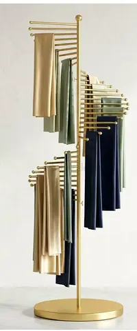 Gold rotating clothes display rack / garment stand