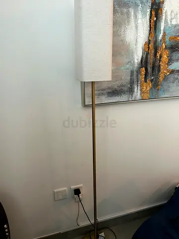 2 tall brass floor lamps with white fabric shades - good condition.