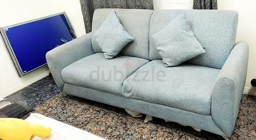 Light blue 3-seater fabric sofa in good condition