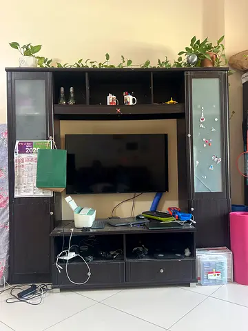 Dark wood entertainment center / TV cabinet with shelves and storage