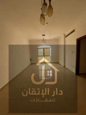 Affordable Two Bedroom Apartment with Balcony in a Prime Location in Al Qulaya'ah, Sharjah, Near a Main Road with Easy Access to Ajman and Dubai.