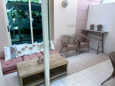 Outdoor rattan patio set with wooden coffee table — good condition