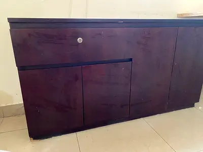 Dark wood low storage cabinet with lock — good for TV or office