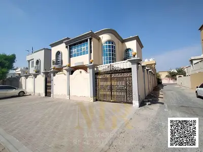 Villa for sale in Al Rawda 3, Ajman, located on a street and a side alley (sikka). Available for fr