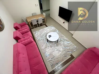 For monthly rent: two rooms, two living areas, three bathrooms, and a balcony, located in Al Taawun
