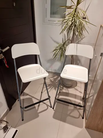 Set of 2 white folding bar stools — good condition