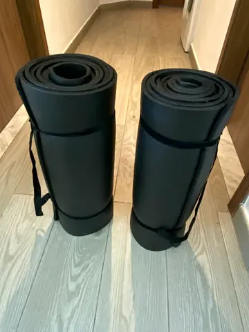 Black yoga mats with straps