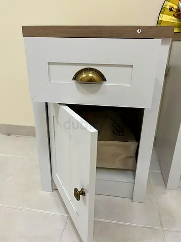 200 AED Moving out sale - 2 White bedside nightstand with storage drawer & cabinet — good condition