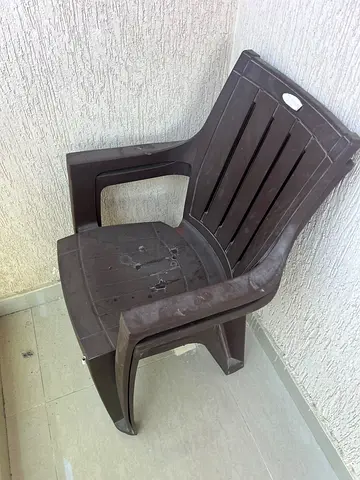 Brown plastic outdoor armchair