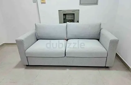 Light beige 2-seater fabric sofa bed in good condition vimle
