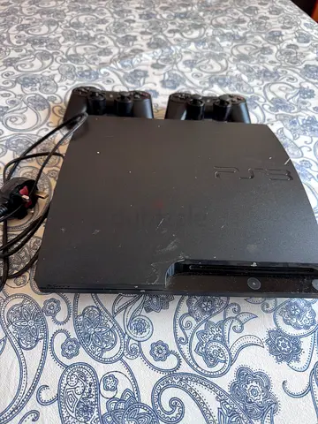 Sony PlayStation 3 Slim console with controllers