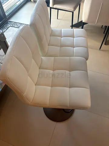 Set of 2 modern white tufted swivel dining chairs - good condition