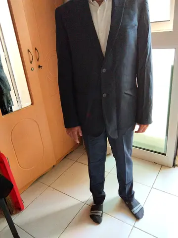 Men's dark grey suit jacket and trousers - good condition .Balmain
