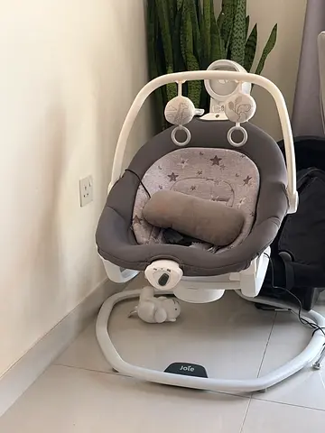 Joie electric baby swing with toy bar — gently used