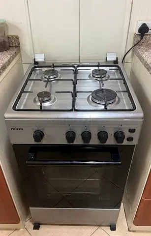 Silver 4-Burner Freestanding Gas Cooker with Oven - Good Working Condition