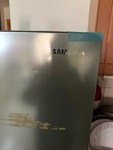 Samsung stainless steel refrigerator door — small dent, good condition