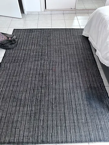 Large dark grey woven area rug - good used condition