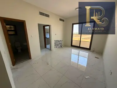 Al Rawda Apartment with Built-In Wardrobes, Balcony and Central AC