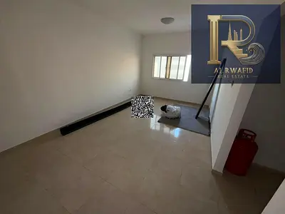 2-bedroom apartment with a living room is available for annual rent in Al Jurf