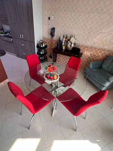 Glass Top Dining Table with 4 Red Upholstered Chairs