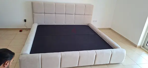 Modern low-profile upholstered king bed frame with padded headboard