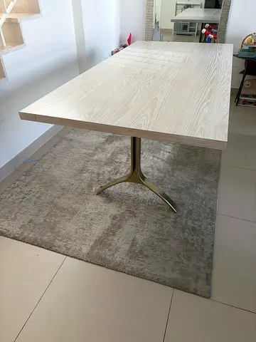 Light wood dining table on gold painted wishbone legs - good condition