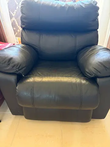 Black leather recliner armchair in good used condition
