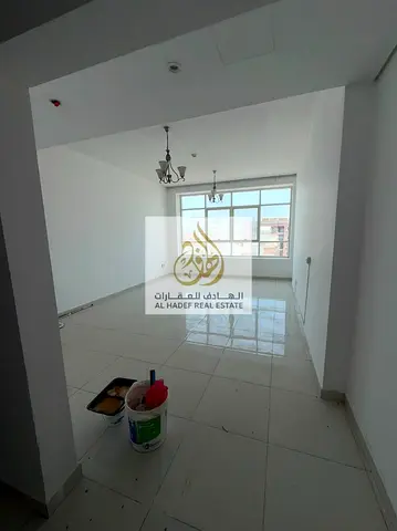 Annual rental in Ajman, Al Rashidiya 3 area. Family-friendly building featuring two rooms, a living room, two bathrooms, built-in wardrobes, two balco
