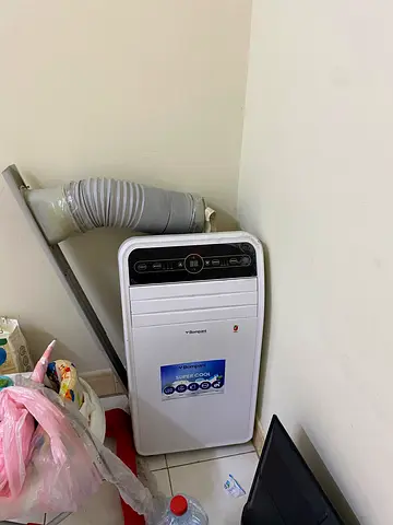Portable air conditioner (used) with exhaust hose and standing fan and TV  all of this 3 items