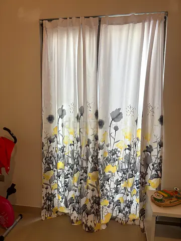 Pair of floral fabric curtains — light-blocking, good condition