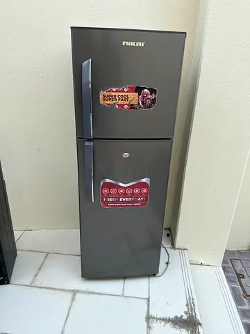 Nikai double-door refrigerator with top freezer, good working condition