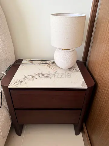 Wooden bedside table with marble top and two drawers