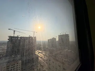 Brand-new spacious 1-bedroom apartment with 2 bathrooms, central AC and tower parking, on Al Ittiha